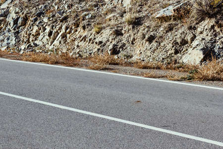 Asphalt road in the mountains a Sunny dayの写真素材