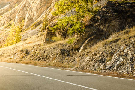 Asphalt road in the mountains a Sunny dayの写真素材