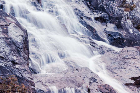 Mountain waterfall on a summer dayの写真素材