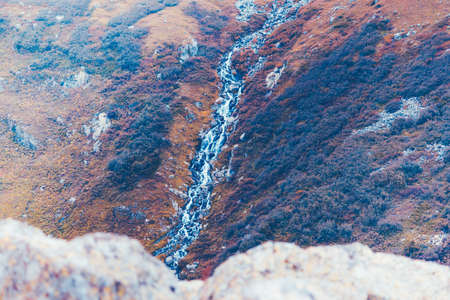 Mountain waterfall in the rocks. Mountain stream, adventure in the mountains.の写真素材