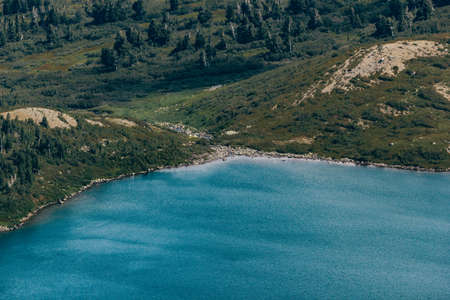 Beautiful mountain lake in the rocky summer dayの写真素材