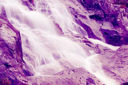 Mountain waterfall on a summer dayの写真素材