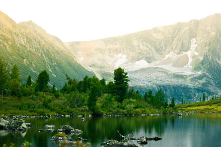 Beautiful mountain lake in the rocky summer dayの写真素材