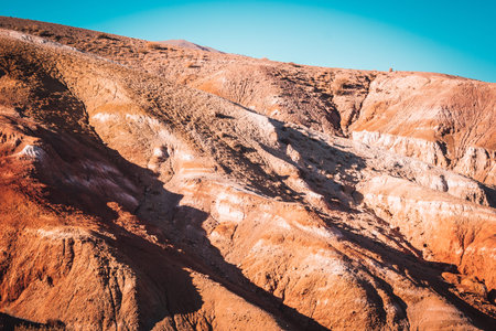 Colored mountains under the blue sky. Red hills of Kyzyl-Chin, Altai. Martian landscape. Red canyon.の写真素材