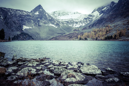 Mountain lake with reflection in the mirrored surface of the rocks. The beauty of the mountain...