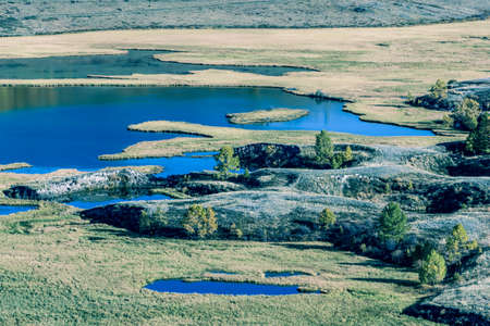 View of the mountain valley with rivers and lakes. Autumn season.の写真素材