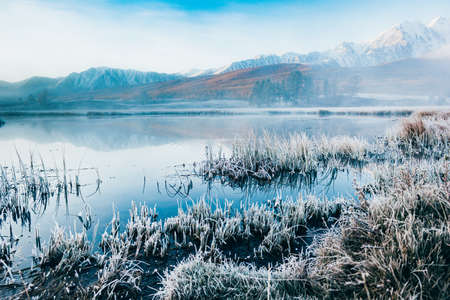 View of the mountain lake foggy morning.の写真素材
