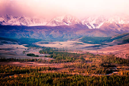 Beautiful view of the snowy mountain peaks. Colorful mountain valley with rocks.の写真素材