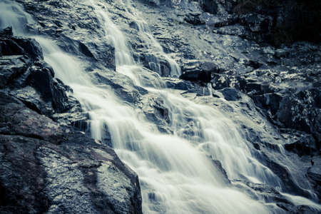 Mountain waterfall on a summer dayの写真素材