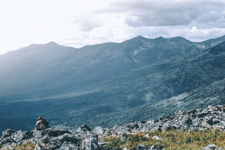 Beautiful view of the rocky ridge. Colorful mountains under the clouds.の写真素材