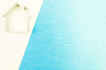 The symbol of the house, a silhouette on a blue background. Copy space for textの写真素材