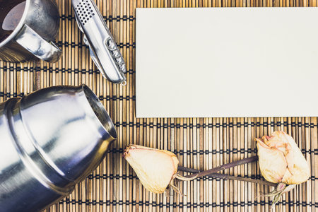 Metal thermos and a mug for tea on a wooden table. Breakfast for tourists, hot drinks with their hands.の写真素材