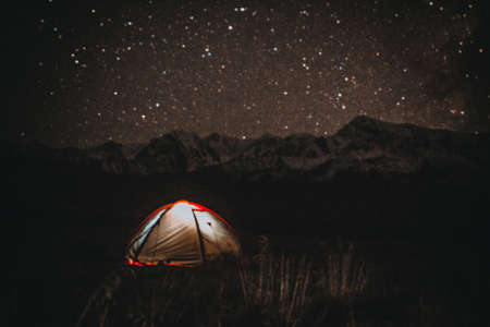 Tourist tent under the starry sky. Grain effectの写真素材