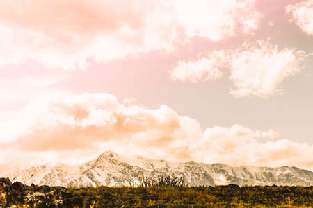 Beautiful view of the snowy mountain peaks. Colorful mountain valley with rocks.の写真素材
