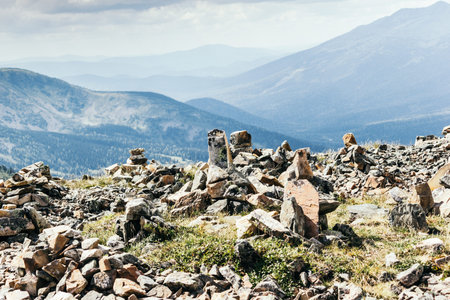 Beautiful view of the rocky ridge. Colorful mountains under the clouds.