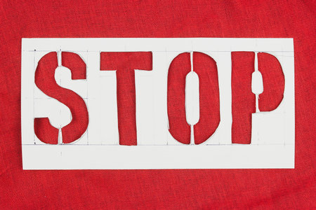 Stop sign in stencil on red background
