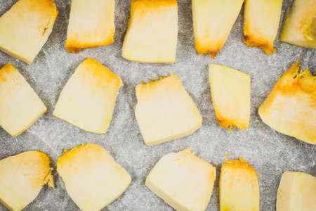 Pieces of baked pumpkin on the tableの写真素材