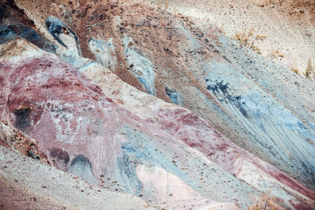 Colorful pink hills under the Sunny sky. Rocks and mountains of pastel colours.