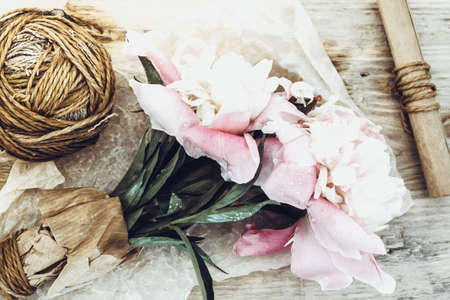 Bouquet of pink peonies on wooden table. Still Life and Gardening.の写真素材