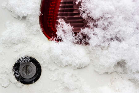 Keyhole under snow. Car lock froze in winter.の写真素材