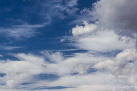 Sky with cumulus clouds at sunset or dawn. Clouds as background