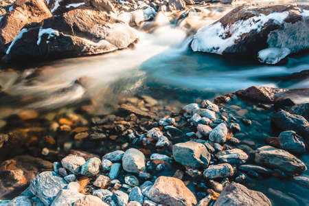 Fast mountain river. Water among stonesの写真素材