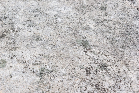 Stone wall. Fragment of gray rock as background