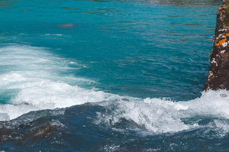 Mountain blue river in mountains. Sea rocks and turquoise sea. Sea voyage along coast.