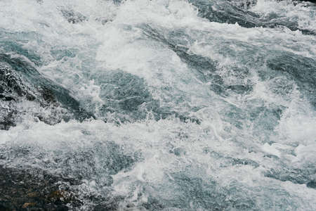 Rough water of sea surf. The water boils in rapid flow of riverの写真素材
