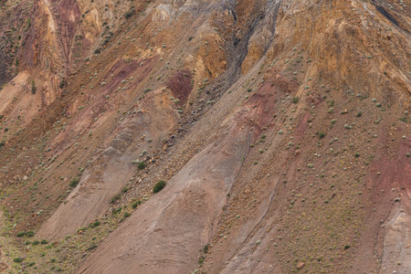 Red hills in canyon. Red colored rocks. Old bed of river in gorge