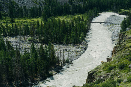 Mountain river in rocks. Flow of water in mountain valley in Altaiの写真素材