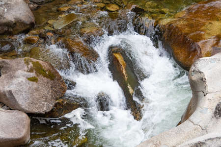 fast flowing river. Mountain stream among rocks. Water tourist tripの写真素材