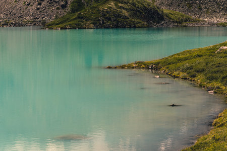 sea bay with stone shore, turquoise lake in rocks, mountain river with blue waterの写真素材