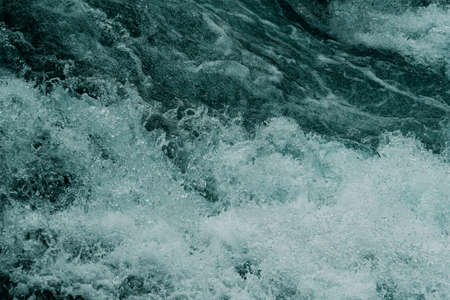 Rough water of sea surf. The water boils in rapid flow of riverの写真素材
