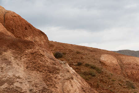 Red hills in canyon. Red colored rocks. Old bed of river in gorgeの写真素材