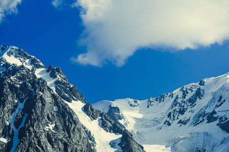 Rocky ridge under the snow. Mountain hiking, wilderness travelの写真素材
