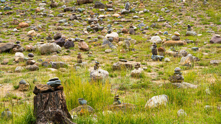 Slide of stones for orientation in forest. Hiking in mountains. Meditation, state of balance of ...