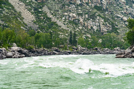 rapid river in mountain gorge, bubbling stream among the rocks,  test for raftingの写真素材