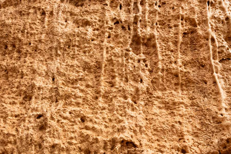 Red mountainside on hot day. Texture on wall of sandy canyon. Lack of water, drought from climate changeの写真素材