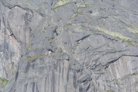 rock wall with cracks and ledges as background, mountain hiking and mountaineering, mountain top...
