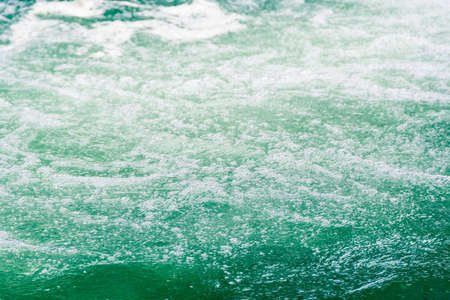 water surface of ocean, sea tide. Rapid flow of riverの写真素材