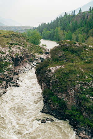 rapid river in mountain gorge, bubbling stream among the rocks,  test for raftingの写真素材