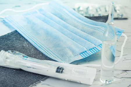 Medical glass ampoules for injection. Preparation for vaccination of patients. Atmosphere of veterinarian office, reception at doctor.の写真素材