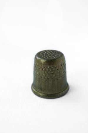 iron metal thimble on white backgroundの写真素材