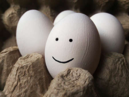 Smile egg on a dark backgroundの写真素材