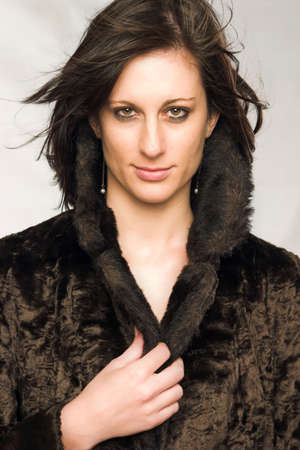 Attractive young female wearing fake-fur coatの写真素材