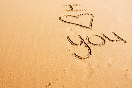 Words written in the beach sandの写真素材