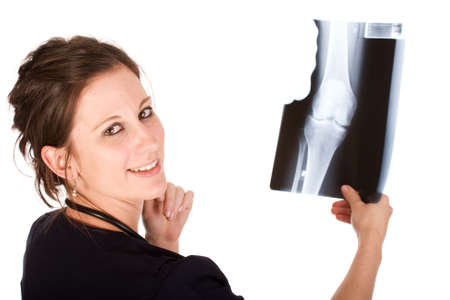 Young attractive female doctor holding a knee x-rayの写真素材