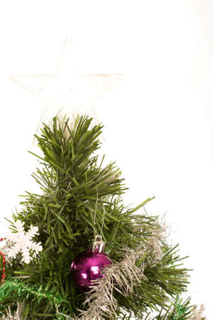 Christmas tree with a star on top against a white backgroundの写真素材
