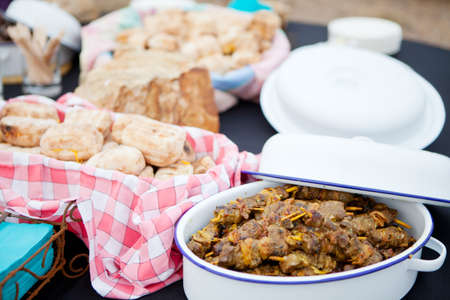 Fresh roasted bread and mutton kebabs in dishes on a tableの写真素材